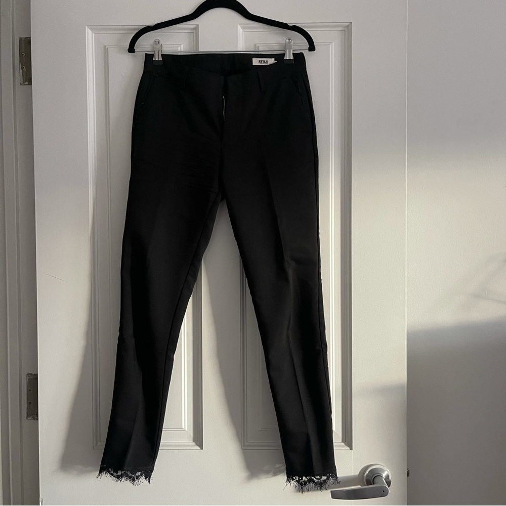 Reiko black straight leg pants with lace trim from Revolve